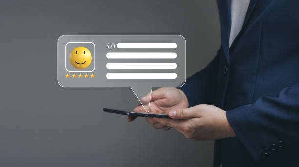 istock Customers Satisfaction survey. male using the application online gave a 5-star rating with happy smile emoji. 1471865113