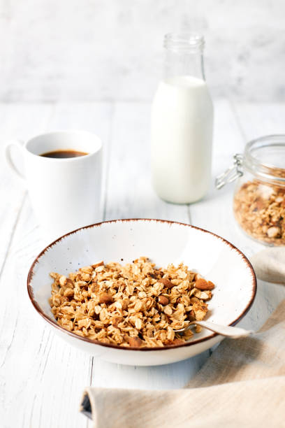 istock Granola with nuts and a cup of coffee for breakfast. Balanced diet for vegetarians or vegans 1471865340