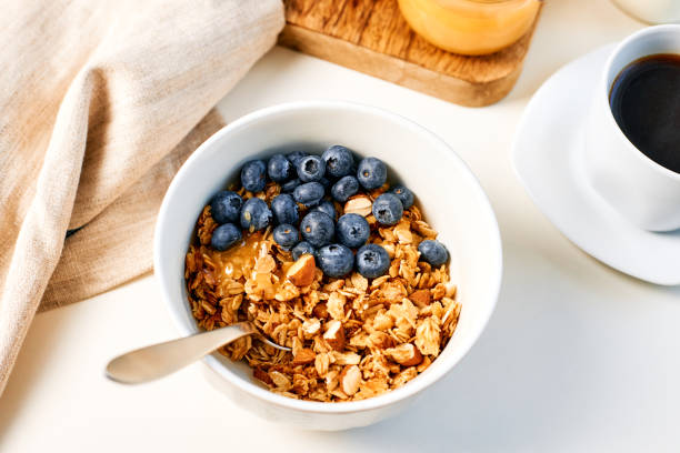 istock Granola with nuts and a cup of coffee for breakfast. Balanced diet for vegetarians or vegans 1471865342