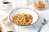 Granola with nuts and a cup of coffee for breakfast. Balanced diet for vegetarians or vegans