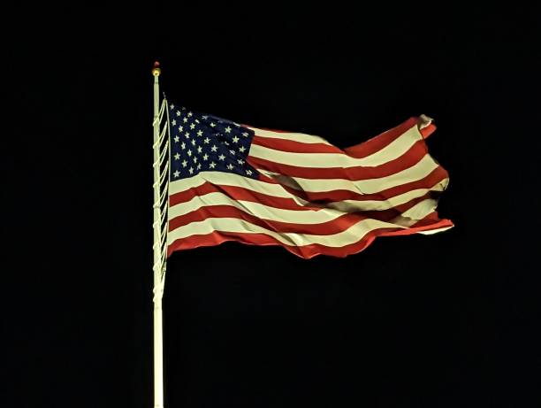 istock American Flag at Night 1471869664