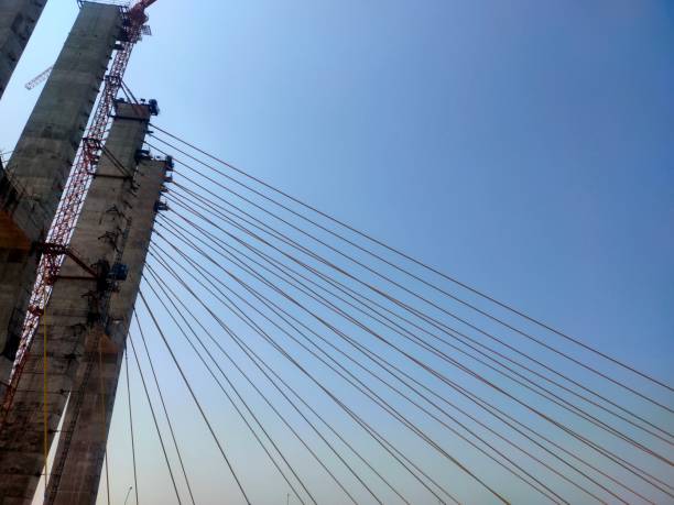 istock Hanging Cable bridge - close-up of concrete pylon and cables 1471871228