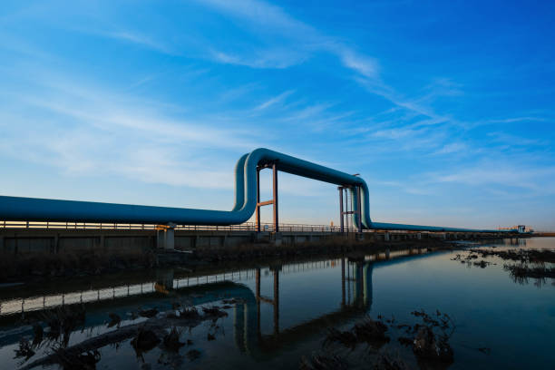 istock Blue pipes going to oil refinery at sunset 1471872482
