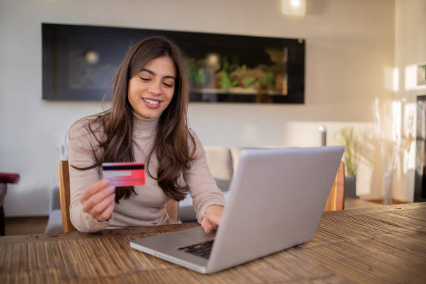 istock Happy young customer enjoys shopping online 1471872668