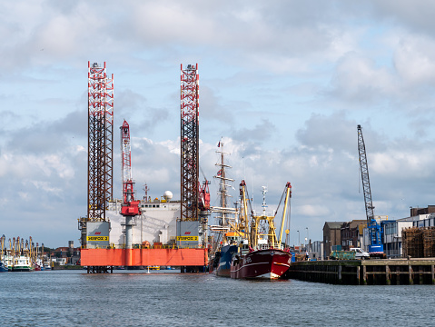 AUG 20, 2021: IJMUIDEN, NETHERLANDS: Offshore platform moored at quay in Vissershaven of IJmuiden, Netherlands