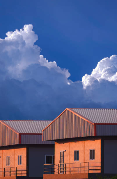 istock Orange sunlight on surface of 2 apartment building against cloudy sky before raining in evening time 1471879112