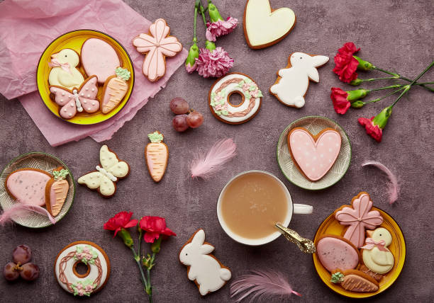 istock Aesthetic Easter background complete decorated cookies, coffee cup, feathers and aster flowers flat lay. Spring background. 1471882909