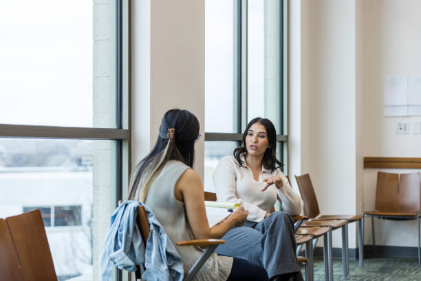 istock Female employee shares concerns with female human resources representative 1471886640