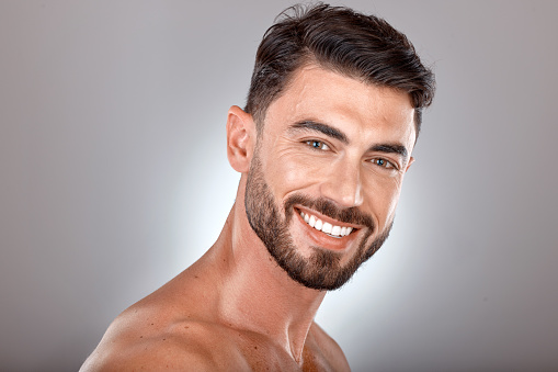 Beauty, skincare and portrait of man with smile on gray background studio for wellness, healthcare and hygiene. Cosmetics, grooming and face of male model for dentistry, body care and spa treatment