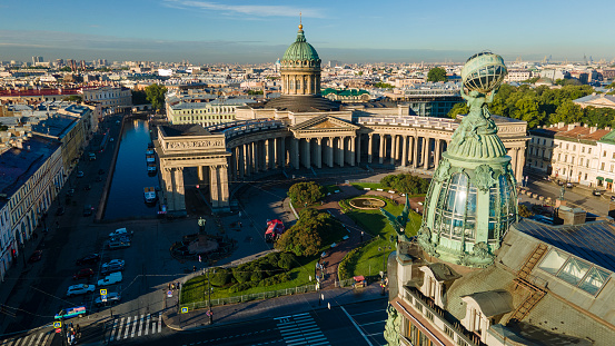 Aerial front, around view of the Kazan Cathedral with in the historical and at the same time modern city of St. Petersburg at sunny summer dawn