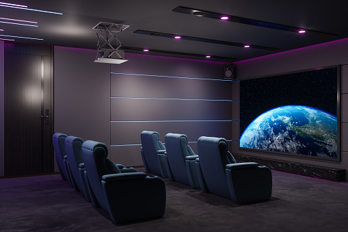 istock Private Home Cinema Room With Projection Screen, Cinema Chairs, Speakers And Neon Lighting 1471891028