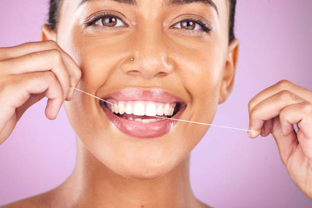 woman portrait, face or flossing teeth on studio background in hygiene mouth maintenance, self care grooming or healthcare wellness routine. zoom, happy smile or beauty model in dental floss cleaning - lipstick make up cosmetics grooming product imagens e fotografias de stock