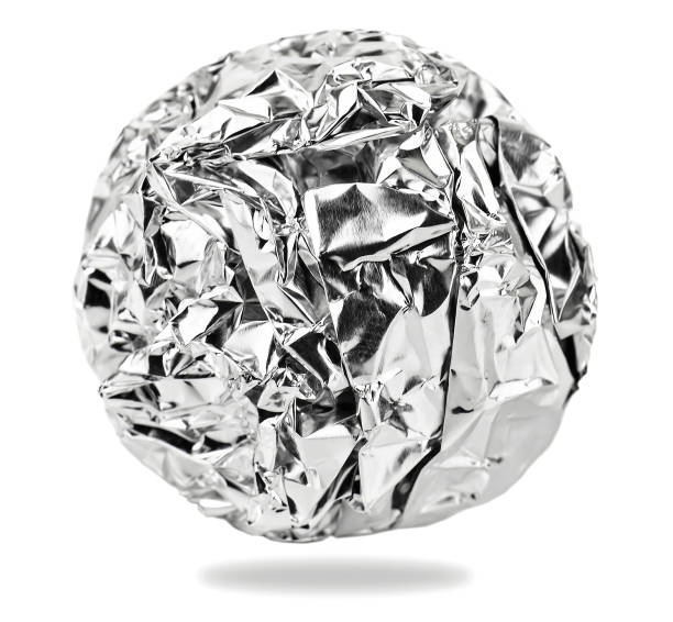 istock Foil aluminum crumpled ball on white 1471894100