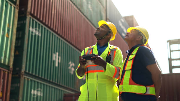 Logistic staffs survey load container for shipping plan in Logistic area company. stock photo