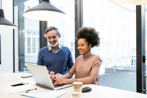 istock Financial experts working together in office and analysing market performance 1471898421