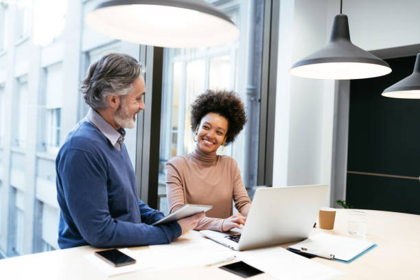 istock Financial experts working together in office and analysing market performance 1471898422