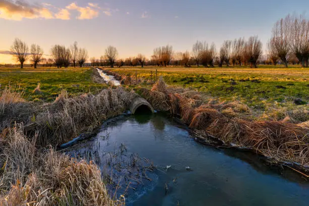 Water culvert on a drainage ditch. Land of Zuława - areas produced by the accumulation of river material in Delta rivers around Elblag, Poland