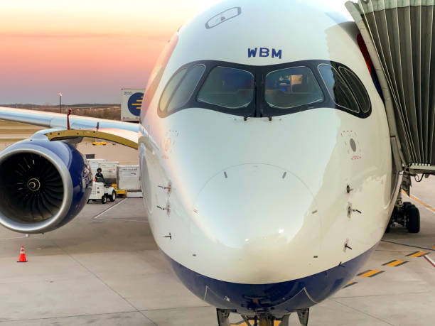 Head on view of a British Airways Airbus A350 passenger jet Austin, Texas - February 2023: Close up head on view of a British Airways Airbus A350 passenger jet (registration G-XWBM) at the city's airport. austin airport stock pictures, royalty-free photos & images