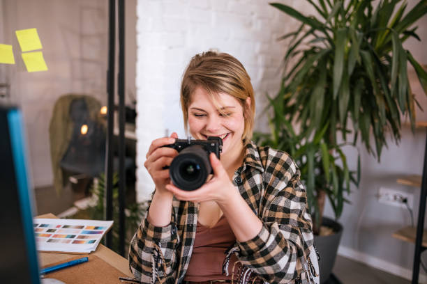 istock Young photographer working at her home office. 1471903158