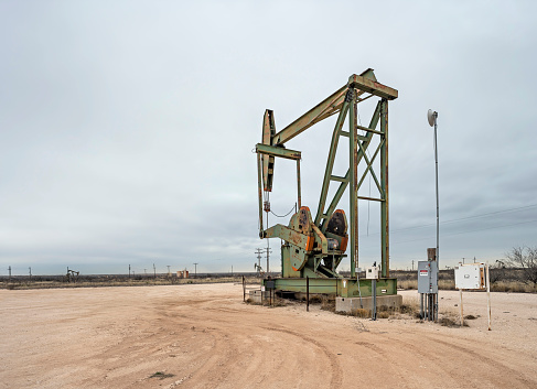 Oil pumpjack on the Permian Basin oil field near Eunice, New Mexico, USA