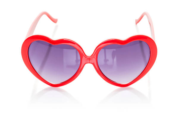 istock Heart shaped sunglasses with red frames isolated on white background with clipping path. 1471906709