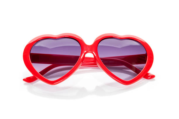 istock Heart shaped sunglasses with red frames isolated on white background with clipping path. 1471906741