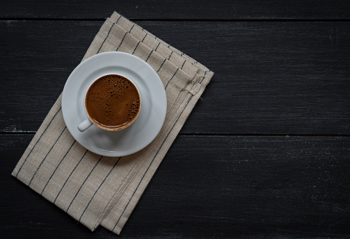Coffee cup on wood