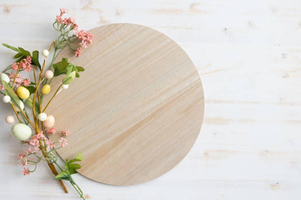 istock Wood disc with frame of pink flowers and easter eggs 1471908156