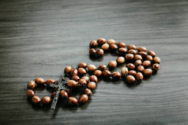 istock Wood rosary on a dark wood background 1471908230