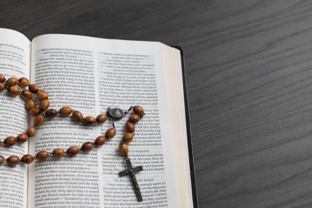 istock Open bible with wood rosary 1471908250