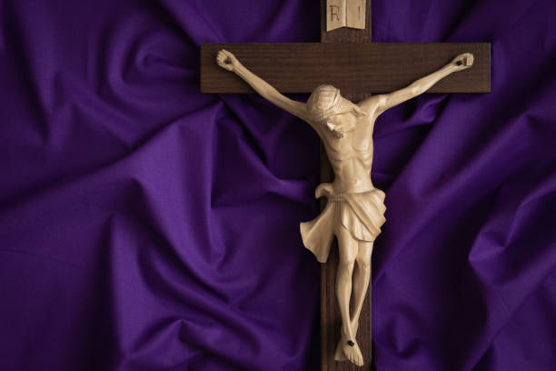 istock Close up crucifix on dark purple 1471908358