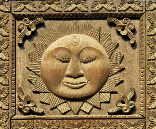 Carved wooden door fragment with sun symbol background and texture, Nepal, UNESCO World Heritage Site, Pashupatinath Temple. stock photo