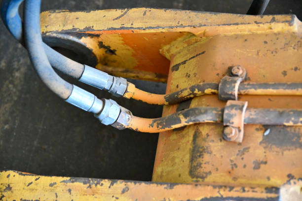 Detail of Yellow Bulldozer with sky in background\