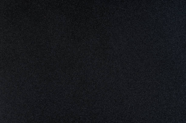 istock Grainy blank black color paper texture 1471913391