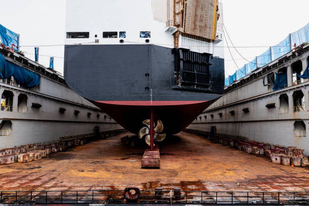 istock Ships in dry dock under repair and maintenance 1471913447