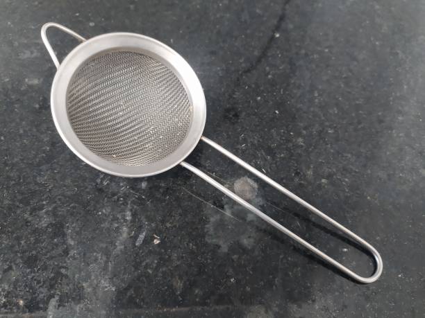 istock A stainless steel sieve on a black marble surface 1471913591