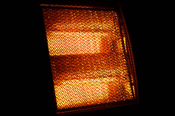 istock Glowing heating element of hot home electric heater 1471914619