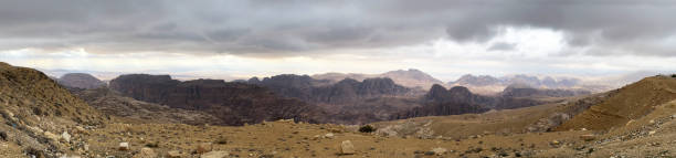 Inhospitable landscape panorama concealing Petra, the Rose City, Jordanian Desert, Jordan stock photo