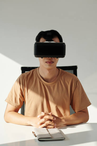 istock Businessman in VR Headset Making Video Call 1471917113