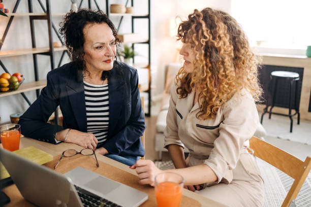 istock Mother and daughter work together from home 1471918604
