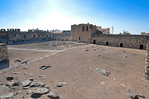 A notable crusader castle, Qsar al-Azraq was built by the Romans in the 3rd Century AD due to its location along the Wadi Sirhan trade route and proximity to water. Constructed from black basalt, Qsar al-Azraq became an important military base during the Byzantine periods being reconstructed in the early 13th Century The castle was used in World War 1 as the base for British archaeologist and military officer T.E. Lawrence, LAwrence of Arabia, during 1917 before the final attack on Turkish forces in Damascus resulting in the downfall of the Ottoman Empire