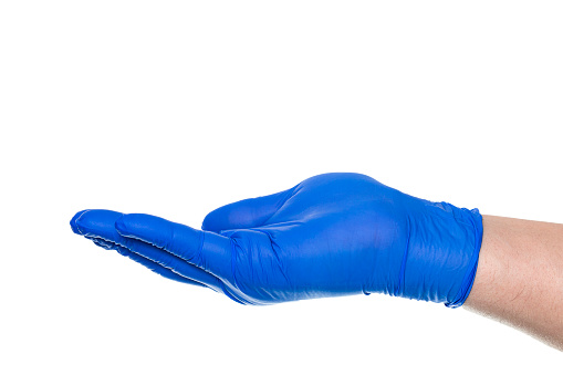 Side view of crop anonymous hand of person in blue rubber glove with open palm against white background
