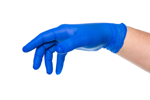 Crop anonymous isolated hand of doctor in blue latex glove against white background