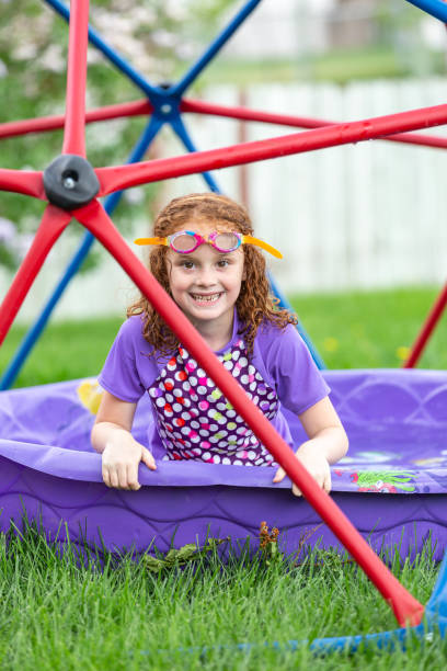 istock Girl Playing in Back Yard on Summer Evening 1471922616
