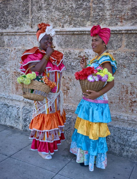 istock Two Cuban canasteras with habano flowers and typical costume 1471922752