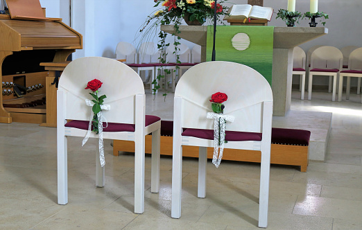 White wedding chairs in a church.