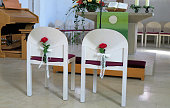 White wedding chairs in a church