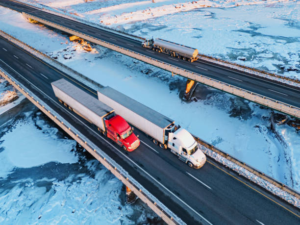 Semi Trucks Crossing Frozen River stock photo