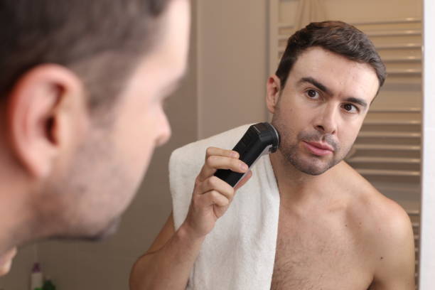 istock Man shaving in front of the mirror 1471930733