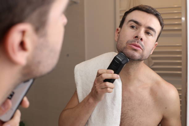 istock Man shaving in front of the mirror 1471931456